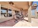 Relaxing covered patio includes ceiling fans, tiled flooring, and ample space for outdoor dining and entertaining at 1289 E Palo Blanco Way, Gilbert, AZ 85296