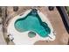 Aerial view of a uniquely shaped pool with a built-in spa and water feature at 1289 E Palo Blanco Way, Gilbert, AZ 85296