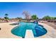 Large backyard pool with a spa, rock waterfall, and a diving board perfect for outdoor enjoyment at 1289 E Palo Blanco Way, Gilbert, AZ 85296