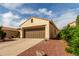 This single Gathering home features a well-manicured lawn and a two car garage at 12930 W Chapala Dr, Sun City West, AZ 85375