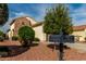 Close-up of a desert landscaped front yard with dual mailboxes, plants, and rock at 12930 W Chapala Dr, Sun City West, AZ 85375