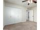 Bedroom features a spacious closet for ample storage and neutral carpet flooring at 13148 N 21St Ave, Phoenix, AZ 85029