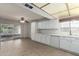 Bright kitchen featuring ample counter space, tile floors, a dishwasher, and a sliding glass door at 13148 N 21St Ave, Phoenix, AZ 85029