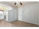 Kitchenette features white cabinets and appliances, with tile floors at 13148 N 21St Ave, Phoenix, AZ 85029