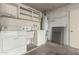 Laundry room features a washer, dryer, and a utility sink for convenience at 13148 N 21St Ave, Phoenix, AZ 85029