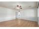 Open-concept living room with laminate flooring and plenty of natural light at 13148 N 21St Ave, Phoenix, AZ 85029