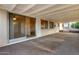 Covered patio features sliding doors and views of the lush backyard at 13148 N 21St Ave, Phoenix, AZ 85029
