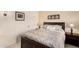 Bedroom featuring a neutral color scheme, a comfortable bed, and matching lamps on bedside tables at 13630 W Aleppo Dr, Sun City West, AZ 85375