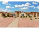 Beautiful single-story home featuring a well-manicured front yard with vibrant bushes and sidewalk at 13630 W Aleppo Dr, Sun City West, AZ 85375
