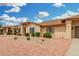Charming single-story home showcasing well-maintained landscaping and rock features at 13630 W Aleppo Dr, Sun City West, AZ 85375