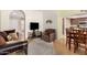 Comfortable living area showcasing a television, plush chair, and dining space at 13630 W Aleppo Dr, Sun City West, AZ 85375