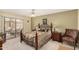Inviting main bedroom with a ceiling fan, patio access, and well-coordinated furnishings at 13630 W Aleppo Dr, Sun City West, AZ 85375