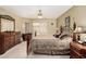 Comfortable main bedroom featuring a ceiling fan, ample storage, and access to the outdoor patio at 13630 W Aleppo Dr, Sun City West, AZ 85375