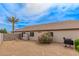 Fully fenced backyard with desert landscaping, shade tree, storage shed and grill at 14374 W Amelia Ave, Goodyear, AZ 85395