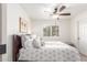 Comfortable bedroom featuring a bed with decorative pillows and a ceiling fan for added comfort at 14374 W Amelia Ave, Goodyear, AZ 85395