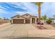 Charming single-story home features a three-car garage, desert landscaping, and a welcoming entrance at 14374 W Amelia Ave, Goodyear, AZ 85395