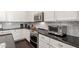 Gourmet kitchen featuring stainless steel appliances, granite countertops and mosaic backsplash at 14374 W Amelia Ave, Goodyear, AZ 85395