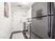 Functional laundry area equipped with a washer, dryer, cabinets, and a convenient folding space at 14374 W Amelia Ave, Goodyear, AZ 85395