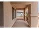 Screened-in patio with shade screens and iron railing at 14374 W Amelia Ave, Goodyear, AZ 85395