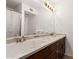 Bathroom features a dual sink vanity, a large mirror, and stylish lighting at 1535 N Horne -- # 35, Mesa, AZ 85203
