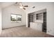 Bright bedroom with vaulted ceiling, built-in shelving, and view from the window at 1535 N Horne -- # 35, Mesa, AZ 85203