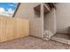 Stucco exterior of house, showing stairs to front door and side yard with privacy fence at 1535 N Horne -- # 35, Mesa, AZ 85203