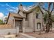 Charming stucco two-story home with a cozy front porch and well-maintained desert landscaping at 1535 N Horne -- # 35, Mesa, AZ 85203