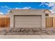 Exterior view of a detached garage door in a neighborhood setting with blue skies at 1535 N Horne -- # 35, Mesa, AZ 85203