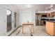 Spacious kitchen with stainless steel appliances, tile floors, access to backyard, and ample storage at 1535 N Horne -- # 35, Mesa, AZ 85203