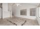 Open concept living room with vaulted ceilings, tile floors, and large windows with lots of light at 1535 N Horne -- # 35, Mesa, AZ 85203