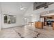 Open floor plan with tile flooring, vaulted ceilings, with view to the kitchen and backyard at 1535 N Horne -- # 35, Mesa, AZ 85203