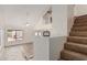 Bright living room with tile floors, vaulted ceiling, stairs, and view to backyard at 1535 N Horne -- # 35, Mesa, AZ 85203