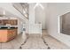 Spacious living room featuring tile flooring, vaulted ceilings, and view to kitchen and stairs at 1535 N Horne -- # 35, Mesa, AZ 85203