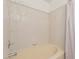 Close up of a tiled bathtub and shower stall with neutral beige tile at 1535 N Horne -- # 35, Mesa, AZ 85203