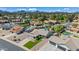 Beautiful aerial view of a well-maintained property with lush landscaping, mature trees, and a home with great curb appeal at 15430 N 51St Pl, Scottsdale, AZ 85254