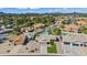 Expansive aerial view of the community with a pool, lush landscaping, and mountain views at 15430 N 51St Pl, Scottsdale, AZ 85254
