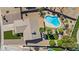 Top-down aerial view showcasing the home's private backyard with a pristine pool, turf area, and lush landscaping at 15430 N 51St Pl, Scottsdale, AZ 85254