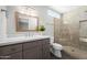 Bathroom features granite vanity, decorative mirror and upgraded walk-in shower at 15430 N 51St Pl, Scottsdale, AZ 85254