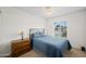 Bedroom features a comfortable bed, a window with blinds, and wood bedside dresser at 15430 N 51St Pl, Scottsdale, AZ 85254
