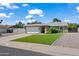 Charming single-story home with a well-manicured lawn and mature landscaping, offering great curb appeal at 15430 N 51St Pl, Scottsdale, AZ 85254