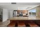 Kitchen features a breakfast bar with seating, stainless steel appliances, and granite countertops at 15430 N 51St Pl, Scottsdale, AZ 85254