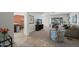 Spacious living room with neutral tones, carpet flooring, and a large window overlooking the backyard pool at 15430 N 51St Pl, Scottsdale, AZ 85254