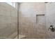 Shower features upgraded tile surround, corner seat and shampoo niche at 15430 N 51St Pl, Scottsdale, AZ 85254