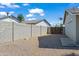 Low-maintenance side yard with gravel ground cover and a secure gate for added privacy at 15430 N 51St Pl, Scottsdale, AZ 85254