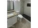 Updated bathroom featuring modern fixtures, tiled floors, shower and granite vanity at 1615 W Michelle Dr, Phoenix, AZ 85023
