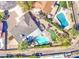 Aerial view of a beautifully landscaped home with a sparkling pool, spa, and inviting outdoor spaces at 1853 W Estrella Dr, Chandler, AZ 85224