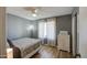 Bright bedroom with wood-look floors and a modern dresser with plenty of storage at 1853 W Estrella Dr, Chandler, AZ 85224