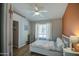 Bedroom with wood-look floors, a closet, and a large bright window at 1853 W Estrella Dr, Chandler, AZ 85224