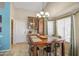 Dining room with a large wood table, seating for six, and lots of natural light at 1853 W Estrella Dr, Chandler, AZ 85224