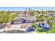 Charming single-story home showcasing a well-manicured lawn and mature trees in a peaceful neighborhood at 1853 W Estrella Dr, Chandler, AZ 85224